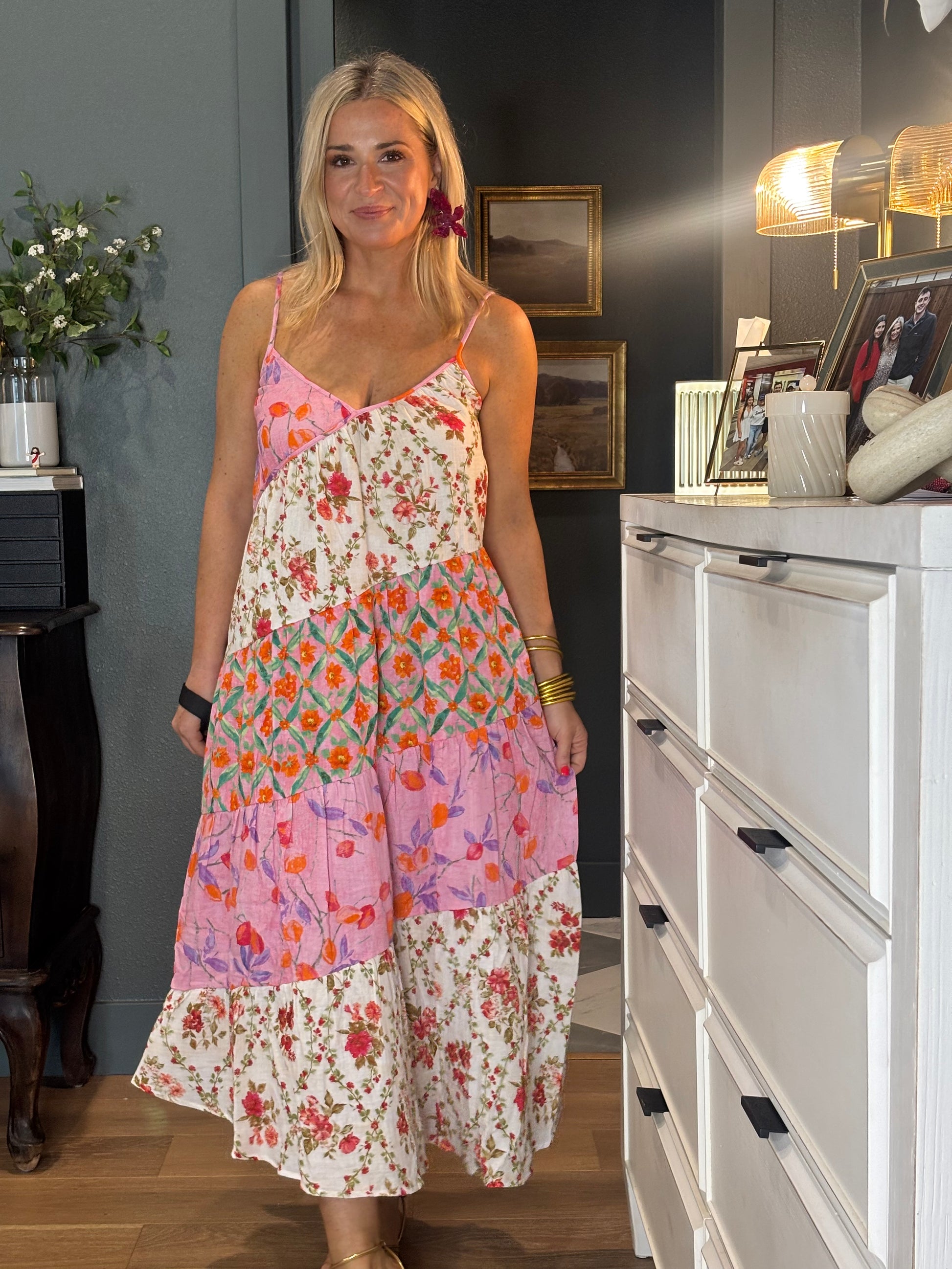 Woman wearing a colorful floral dress 